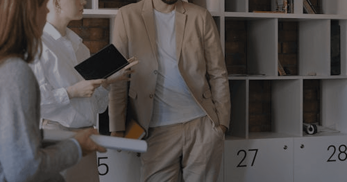 sales team reviewing CRM dashboard laptop - AI in your CRM: 4 reasons it fails in the first 8 weeks