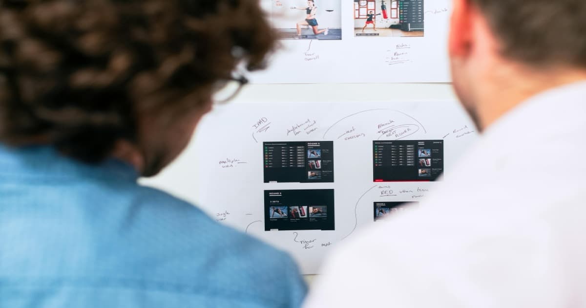 data engineer reviewing AI pipeline architecture on whiteboard