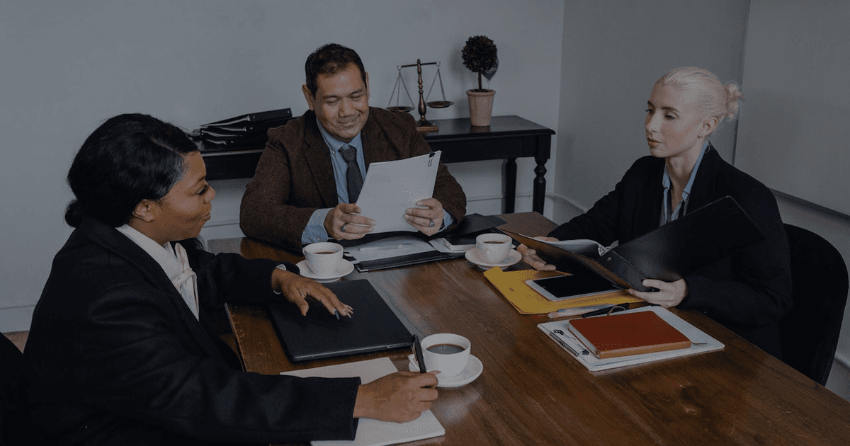 Business leader reviewing AI compliance framework documentation at a desk