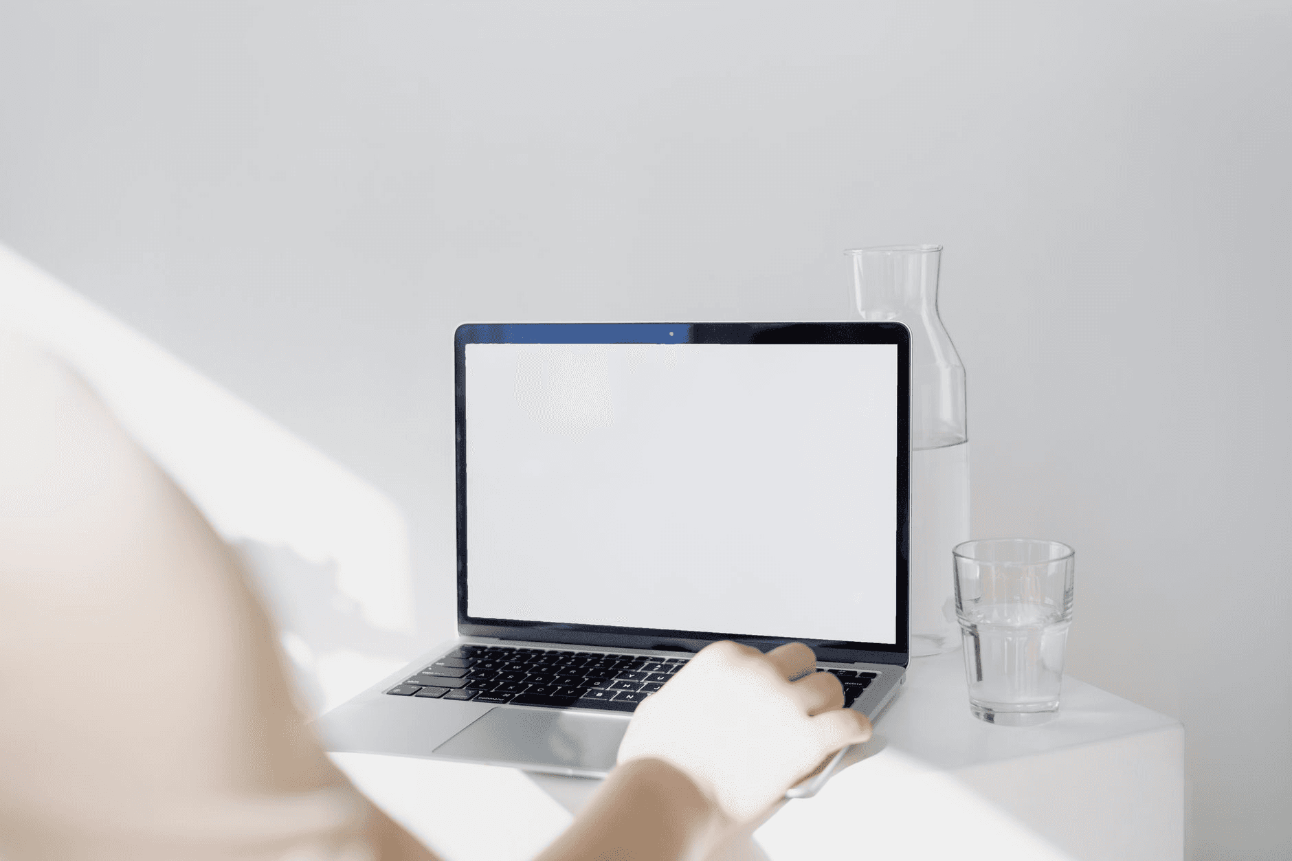 Creator at a desk selling digital products online through a custom storefront