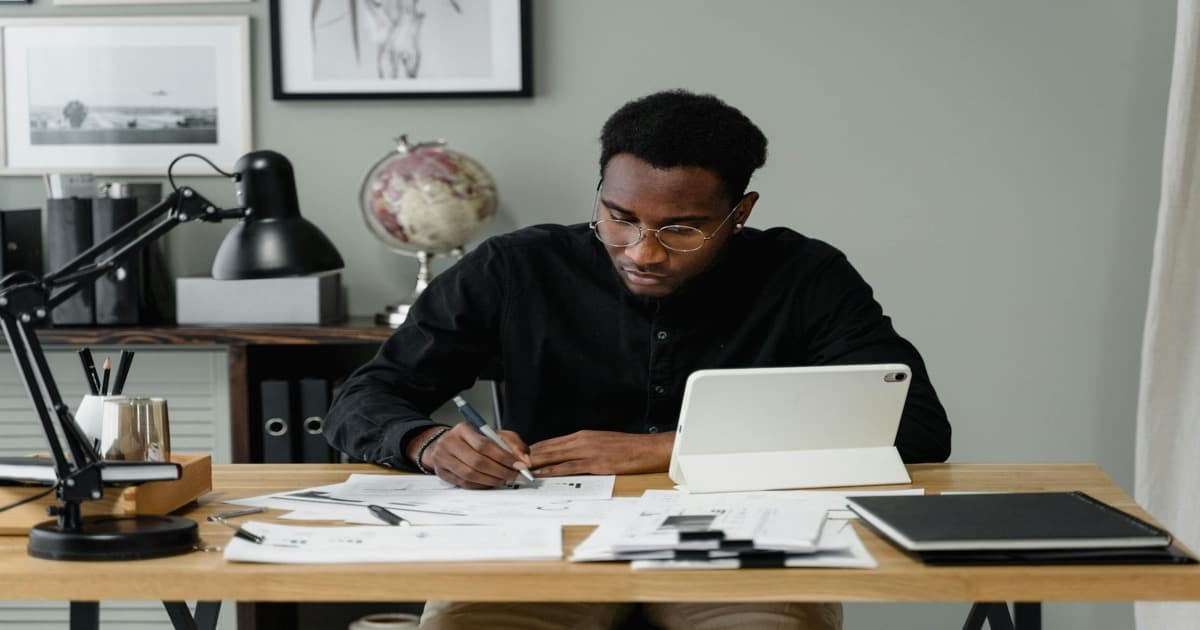 operations manager reviewing manual process costs on spreadsheet