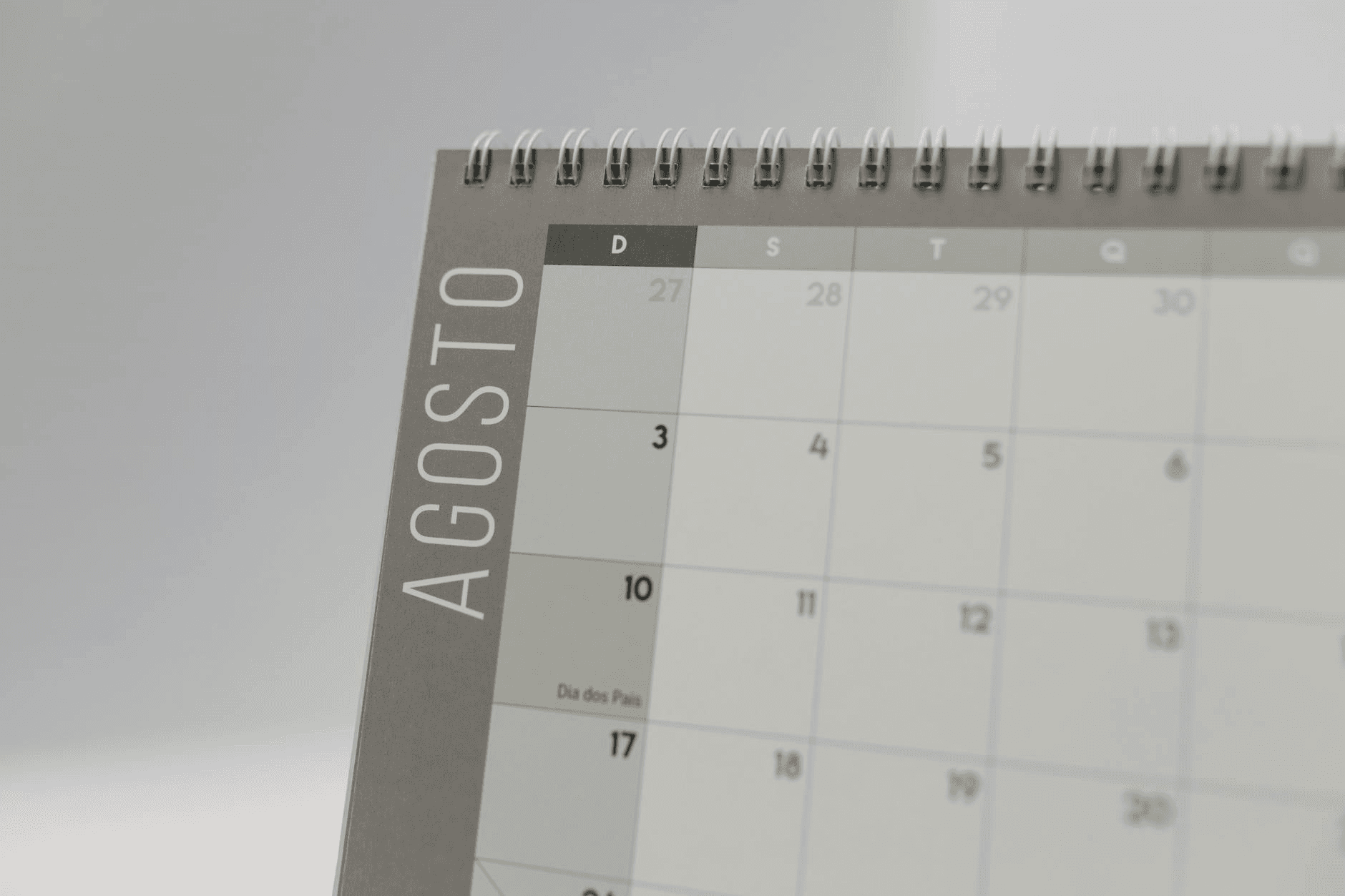 Calendar scheduling interface on a laptop screen with appointment booking flow