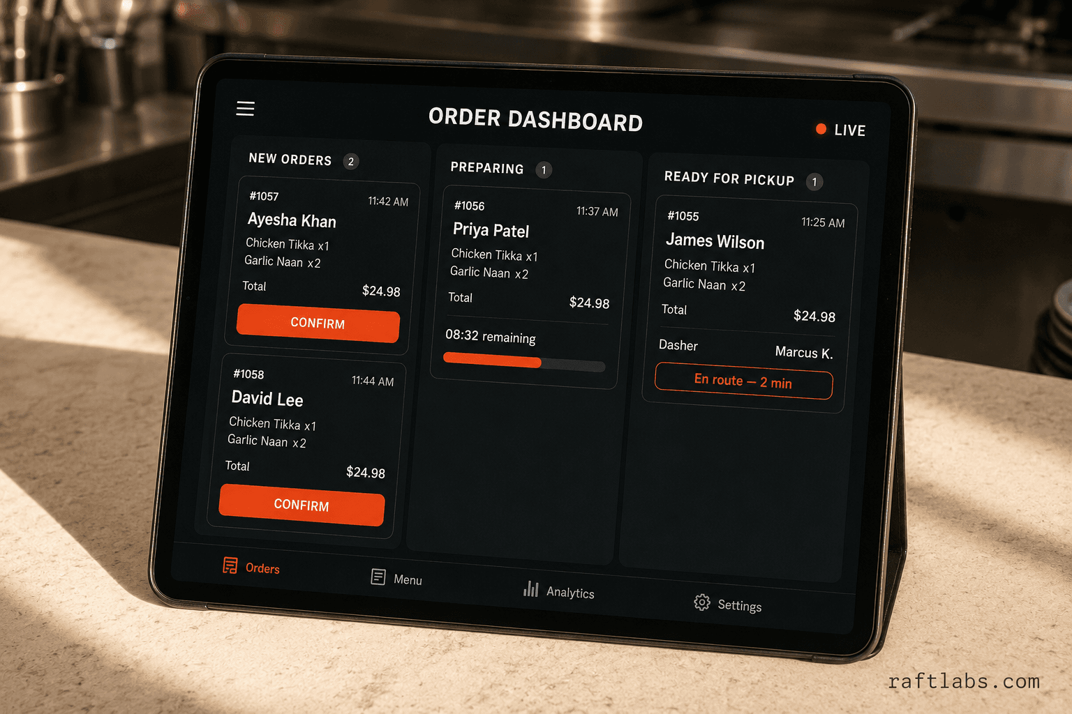 Restaurant order management dashboard on a tablet showing new orders, preparing status, and ready for pickup columns