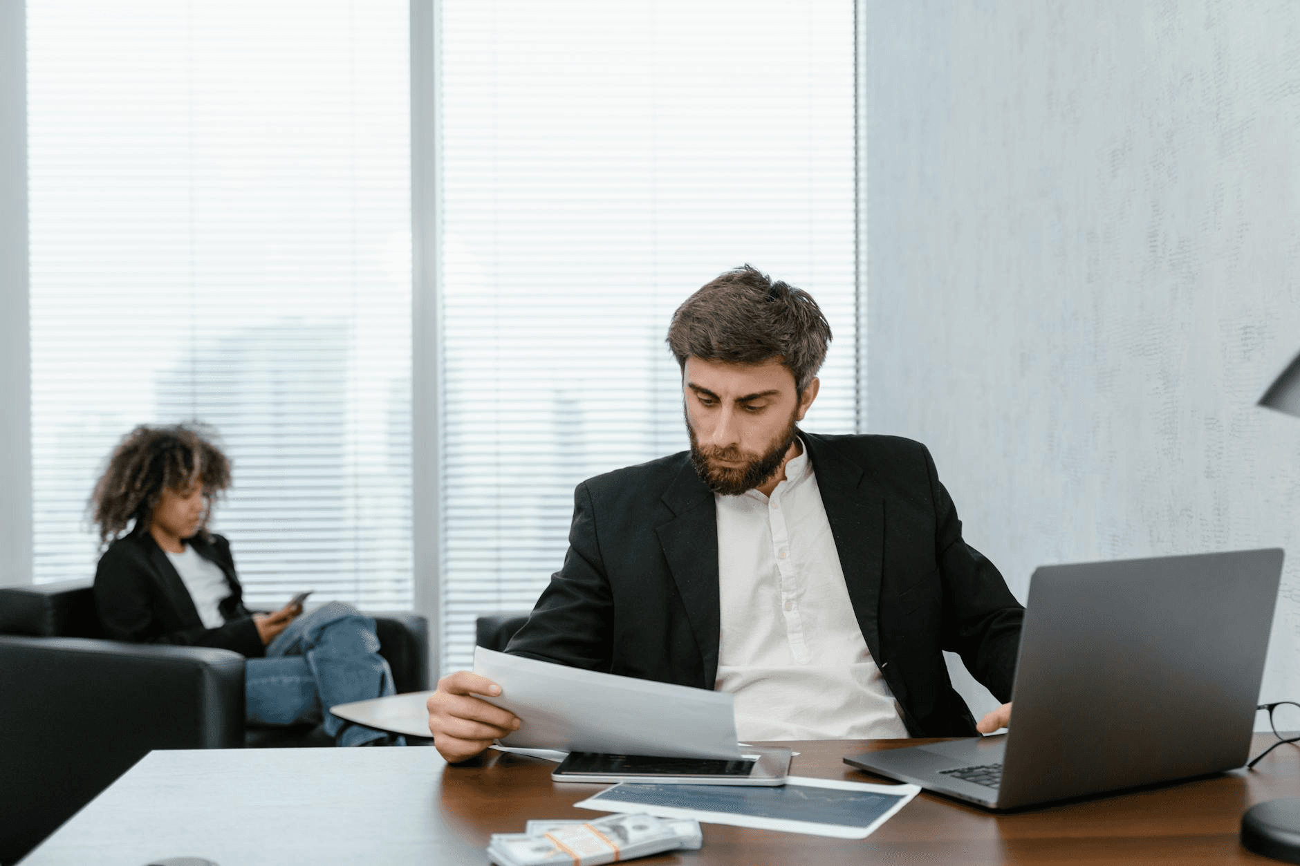 HR manager reviewing payroll dashboard on laptop - how to build an app like Gusto