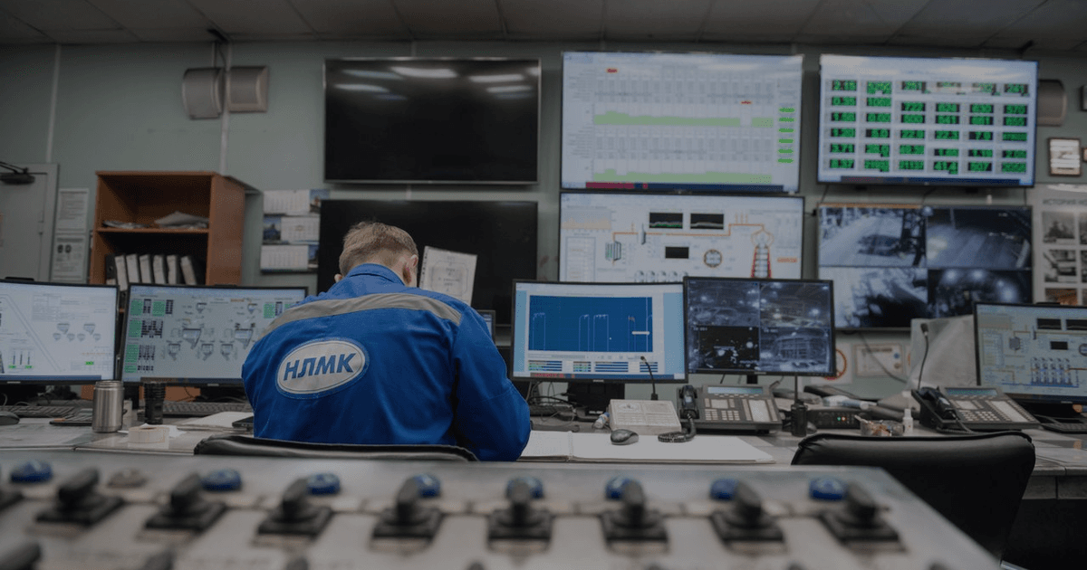 Engineer reviewing IoT device dashboard and sensor data on multiple monitors