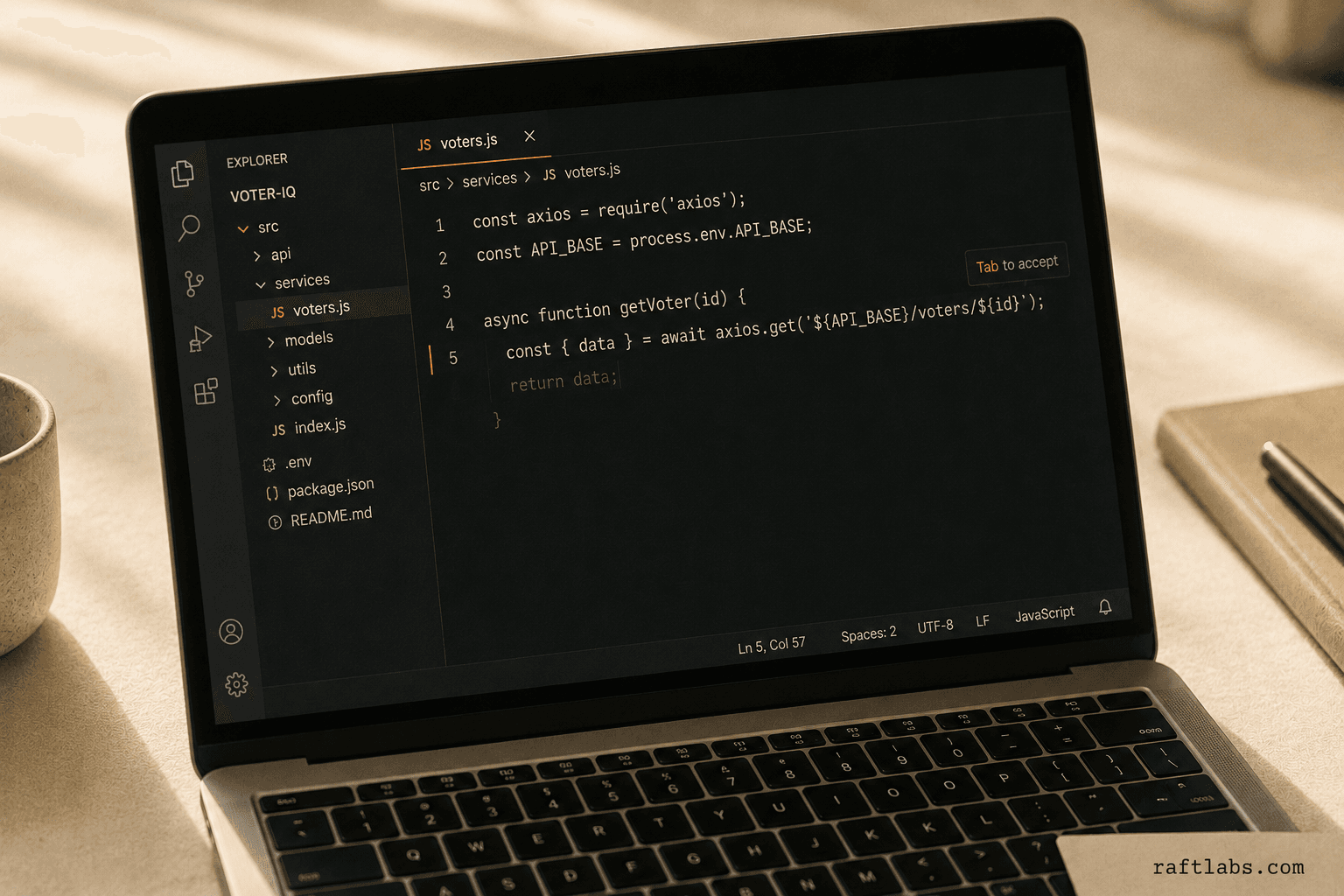 Laptop screen showing an inline AI code completion suggestion appearing after the cursor in a code editor